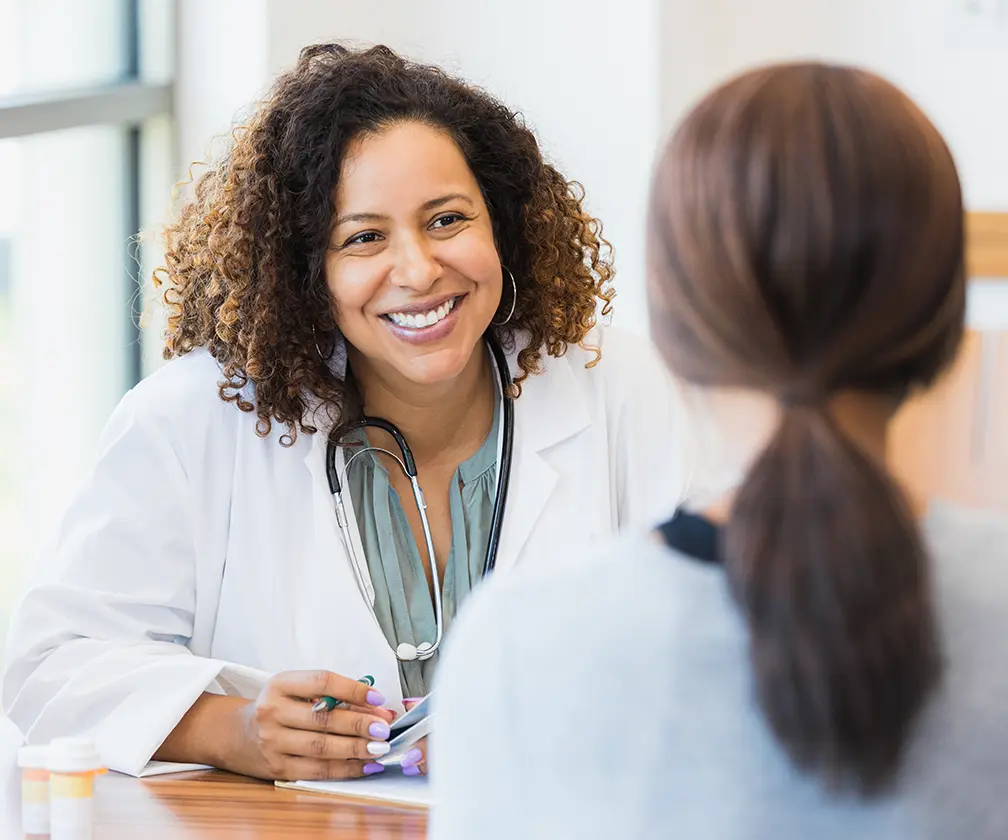 photo of female healthcare provider consulting with a patient