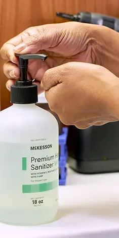 photo of a person dispensing McKesson hand sanitizer