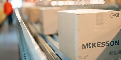 photo of McKesson packages on a conveyor belt in a warehouse