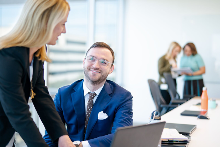 photo of people interacting in a corporate setting