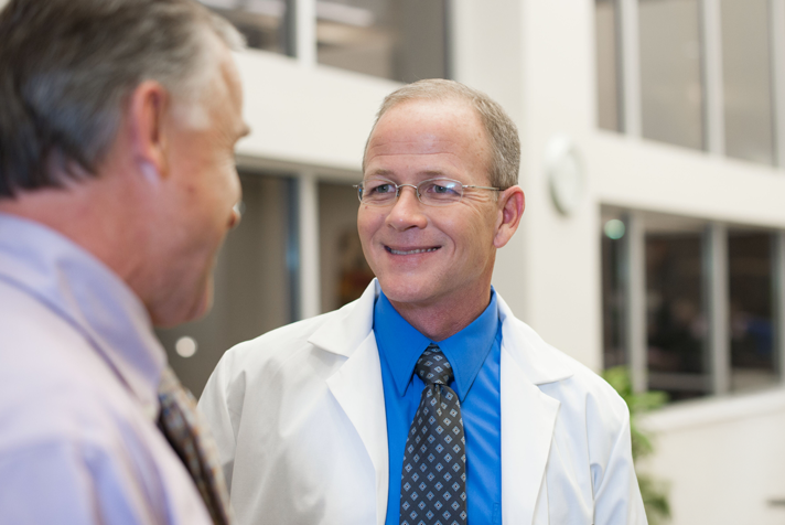 photo of a representative and a medical professional interacting