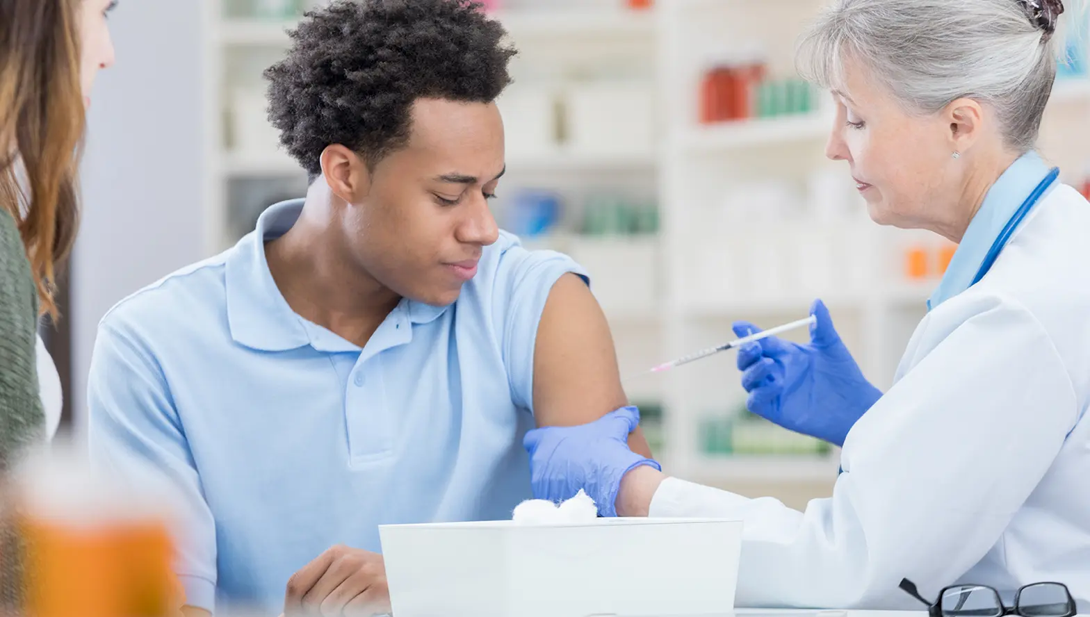 Medical professional giving a flu vaccine in a lab setting