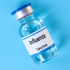 bottle of influenze vaccine in greyscale
