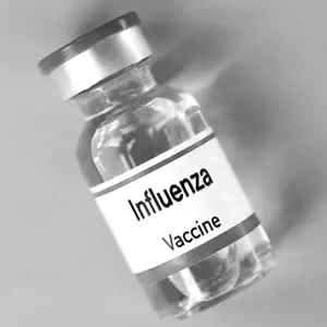 bottle of influenze vaccine in greyscale