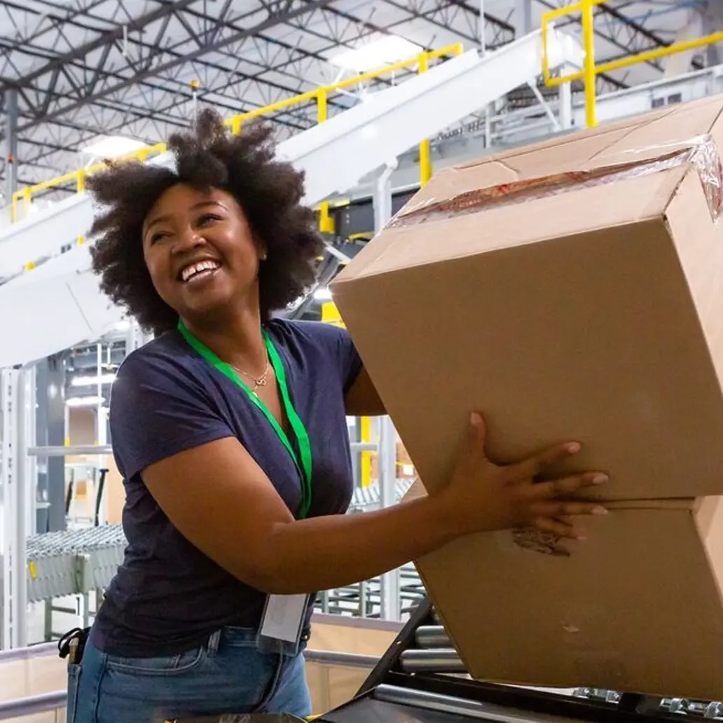 photo of female warehouse worker sorting boxes